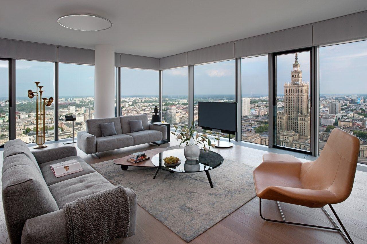 Illustrative apartment interior overlooking Warsaw
